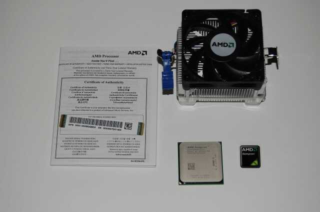 Фотографія процесора AMD Sempron 140 з кулером і сертифікатом