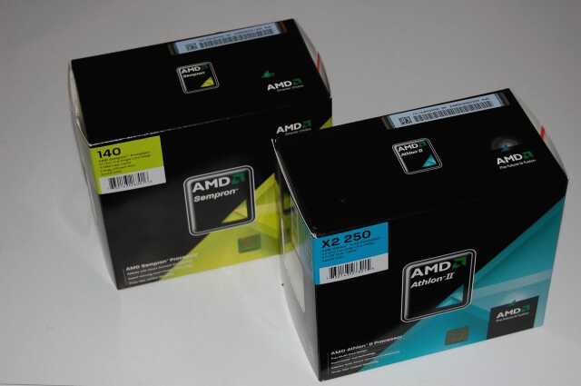 Фотография двух упаковок от процессоров AMD Sempron 140